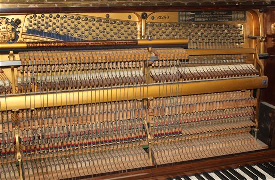 An early 20th century Bluthner rosewood cased upright piano,